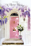 A tranquil yet joyful new-home moment is captured at a Denmark Hill doorstep, where a soft pink front door becomes the heart of a floral daydream. The door, freshly painted and glowing gently in the afternoon light, stands framed by whitewashed walls that reflect every hint of sunshine drifting through the neighbourhood. Overhead, cascades of lavender wisteria spill down in plush, scented clusters, the blooms forming a natural arch that embraces the entrance with a romantic, storybook charm reminiscent of the leafy streets leading toward Ruskin Park. Just at the threshold, slightly off-centre on the stone step, rests a generous bouquet of white and cream roses arranged in a vintage-style metal bucket. The roses are full and velvety, some just opening, others in perfect bloom, interlaced with dusty green foliage that softens the edges and adds a whisper of woodland freshness. A soft pink ribbon, tied around the bucket in a casual yet careful bow, pulls the eye downward and completes the pastel palette with gentle harmony. Light and shadow play across the scene in painterly patterns, making it feel as though time has paused on the very first day in a new home. The composition conveys that quiet thrill of unlocking a new front door for the first time after a move from nearby Camberwell or Peckham, with flowers serving as the first warm hello. Every detail-from the trailing wisteria to the hand-tied roses-speaks of tenderness, optimism, and the loving craft of a Denmark Hill florist who knows how to turn an ordinary doorway into a symbol of welcome, hope, and home.